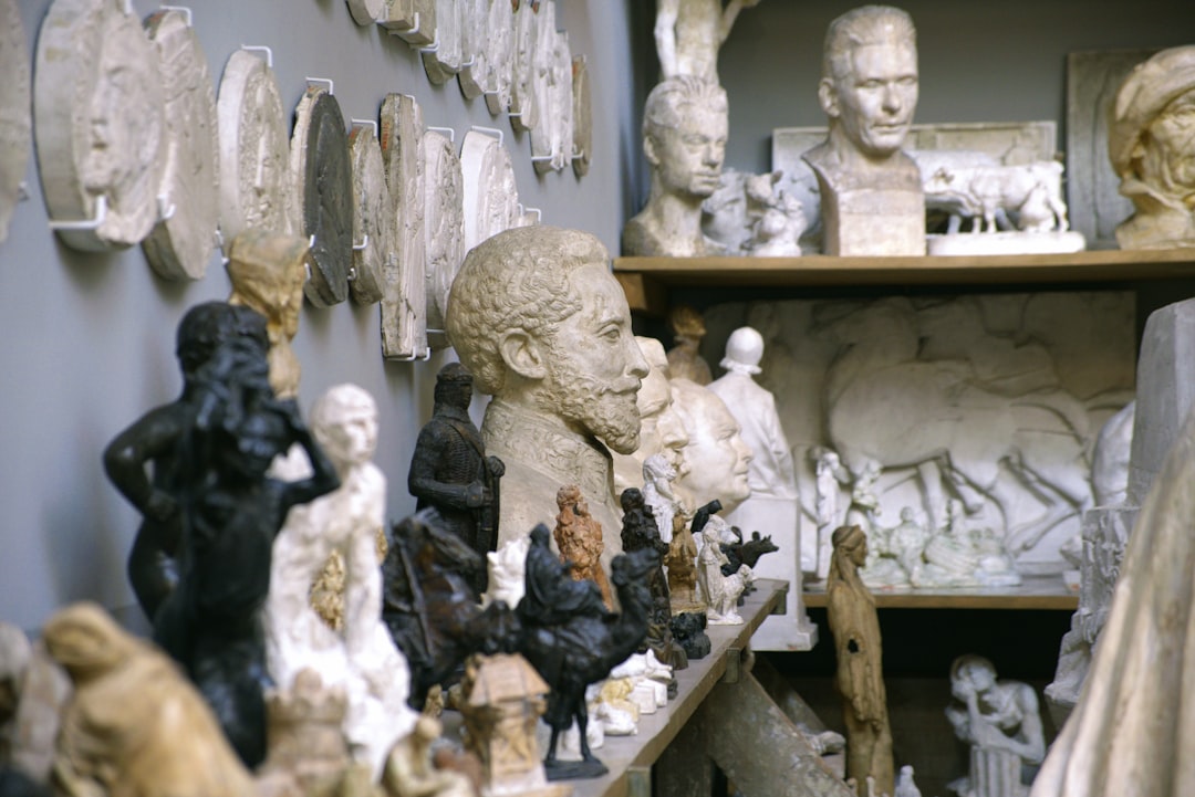 a-room-filled-with-lots-of-different-types-of-statues-pv5dfj37yt4